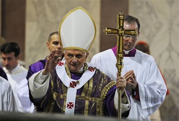 Pope Benedict XVI salutes the faithful during the traditional Ash Wednesday mass in the St. Sabina church in Rome Wednesday, March 9.